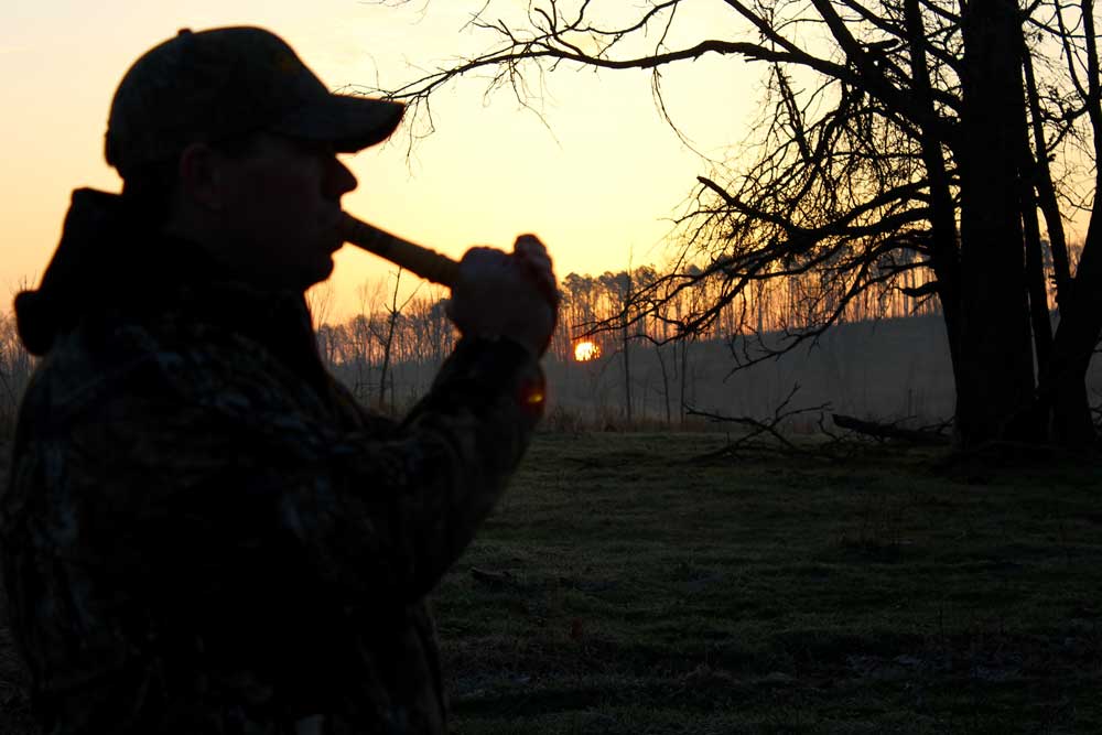 turkey hunter using locator call