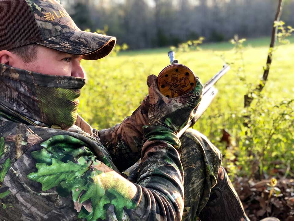 hunter calling turkey with slate call