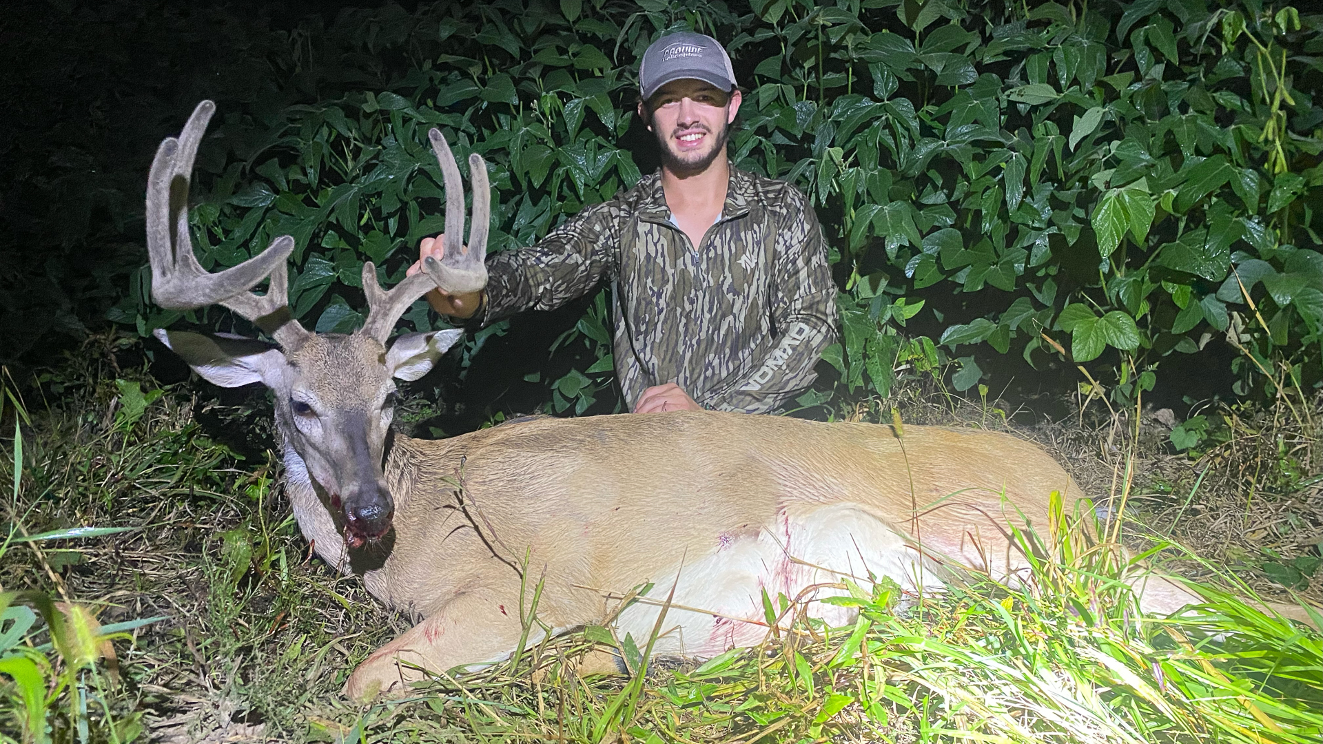 man sits with trophy velvet buck