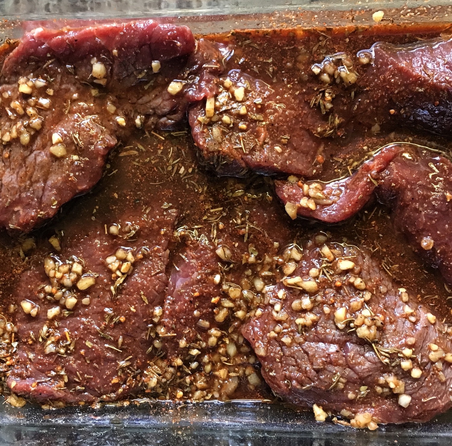 meat marinate in a glass dish