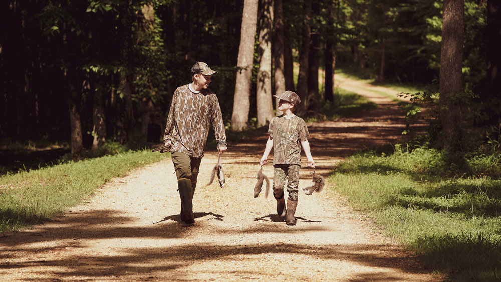 young hunters with squirrels